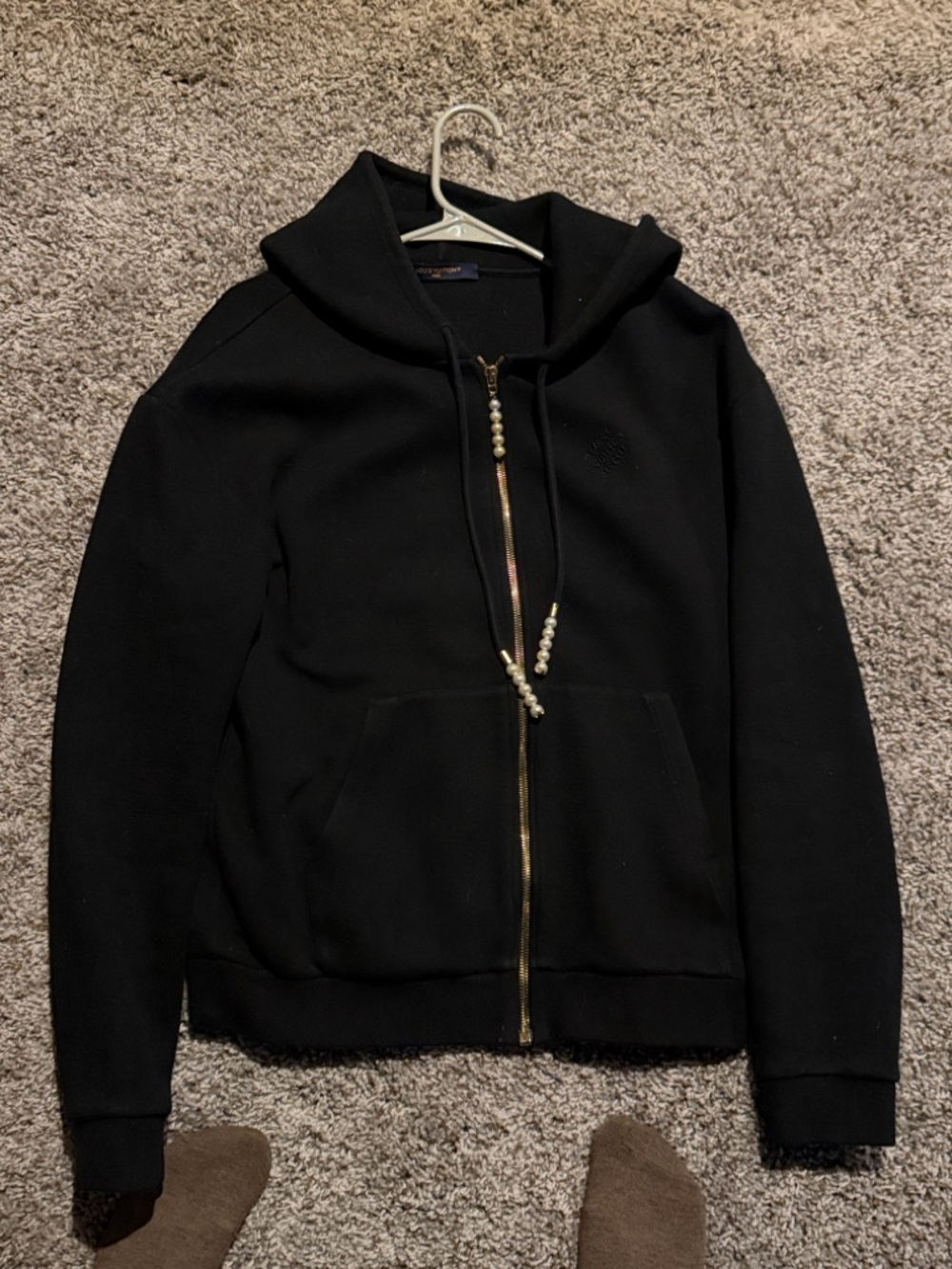 Louis Vuitton navy label with gold lettering